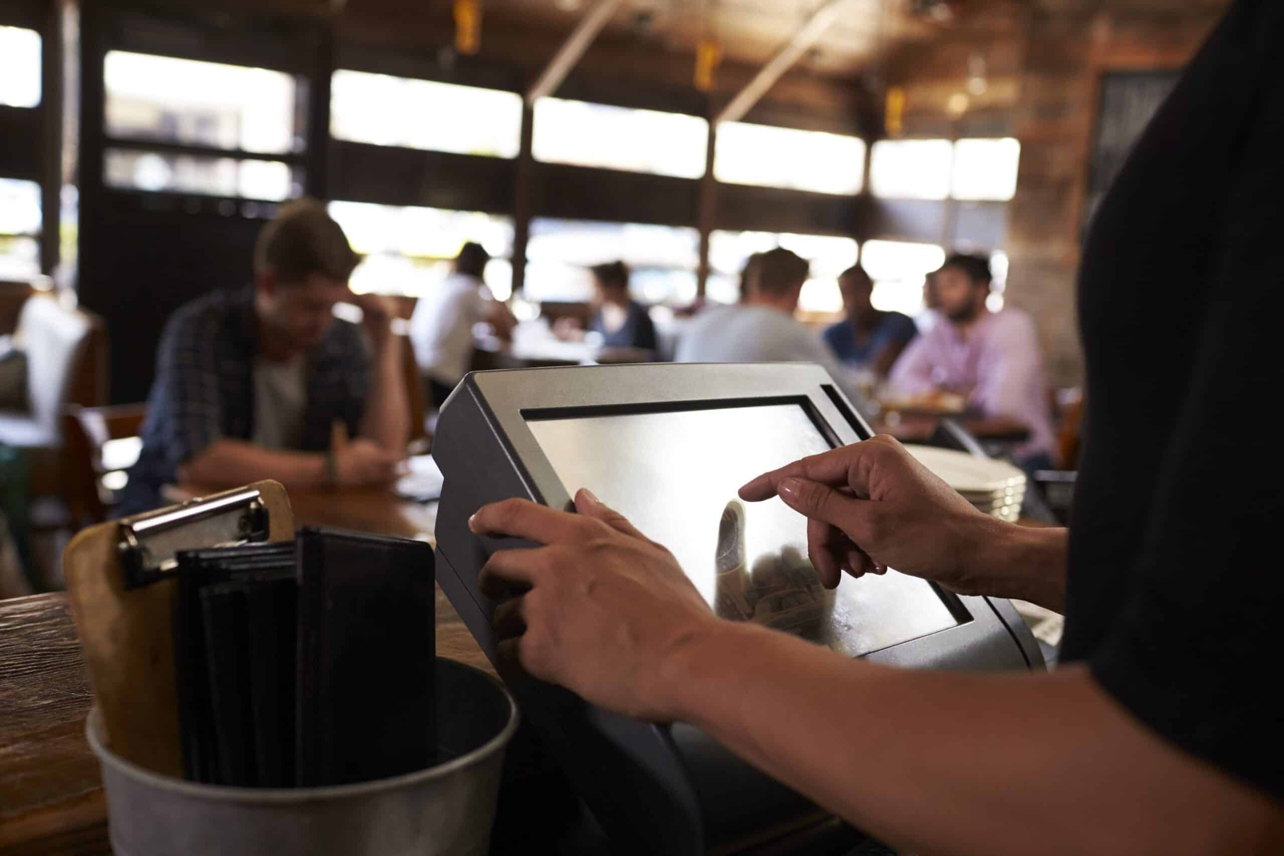 picture of a restaurant with a till